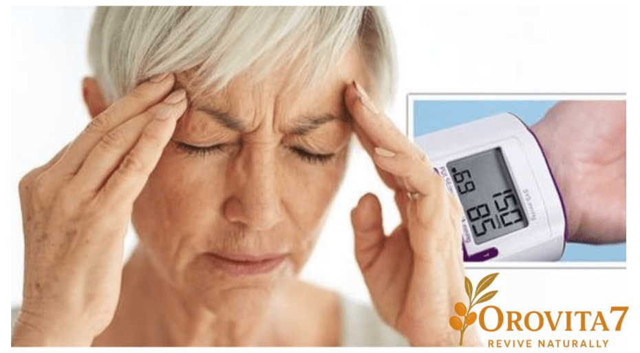 An elderly woman holding her head in pain due to a headache, with an inset image of a blood pressure monitor showing a reading of 150 over 85 and the OroVita7 logo.