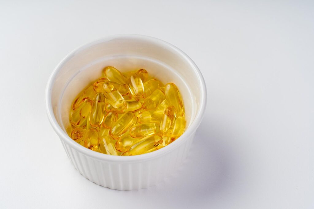 Fish Oil Supplements bottle with omega 3 capsules for daily wellness