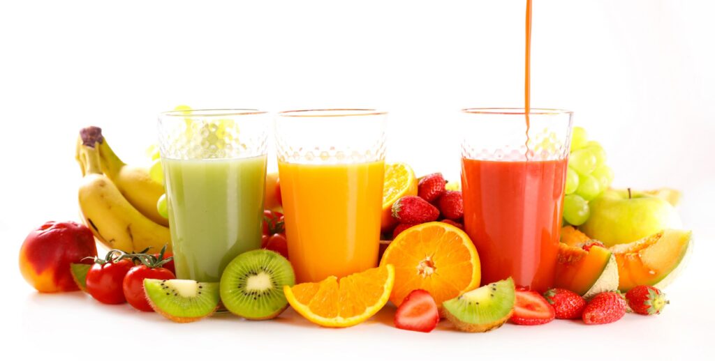 Colorful natural Juices with citrus fruits and berries for healthy lifestyle