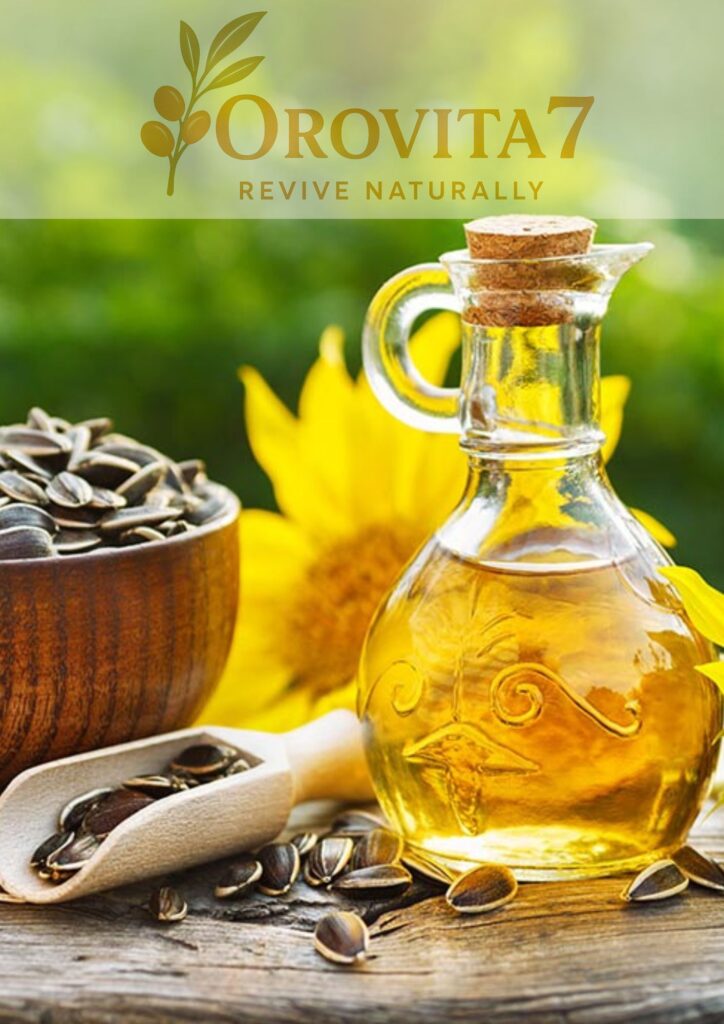 A decorative glass bottle of sunflower oil placed next to a wooden bowl overflowing with black sunflower seeds and a bright yellow sunflower in the background.