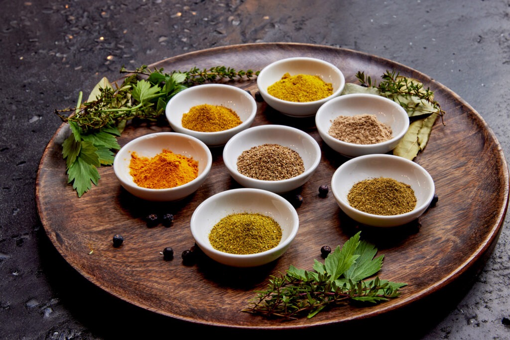 Pitta Imbalance concept with Ayurvedic herbs, fruits, and natural wellness ingredients