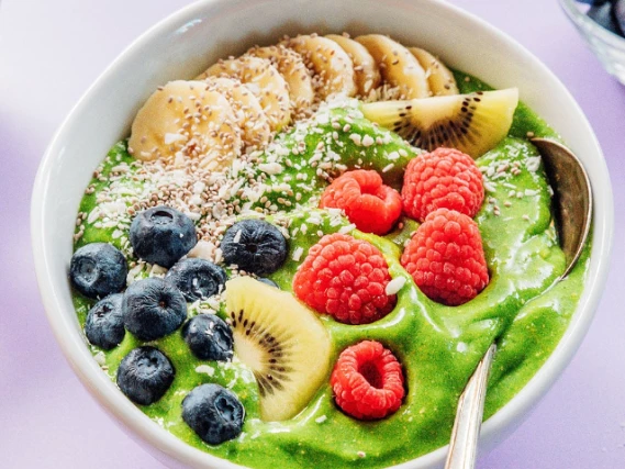 Superfoods assortment with berries, nuts, seeds, and healthy natural ingredients