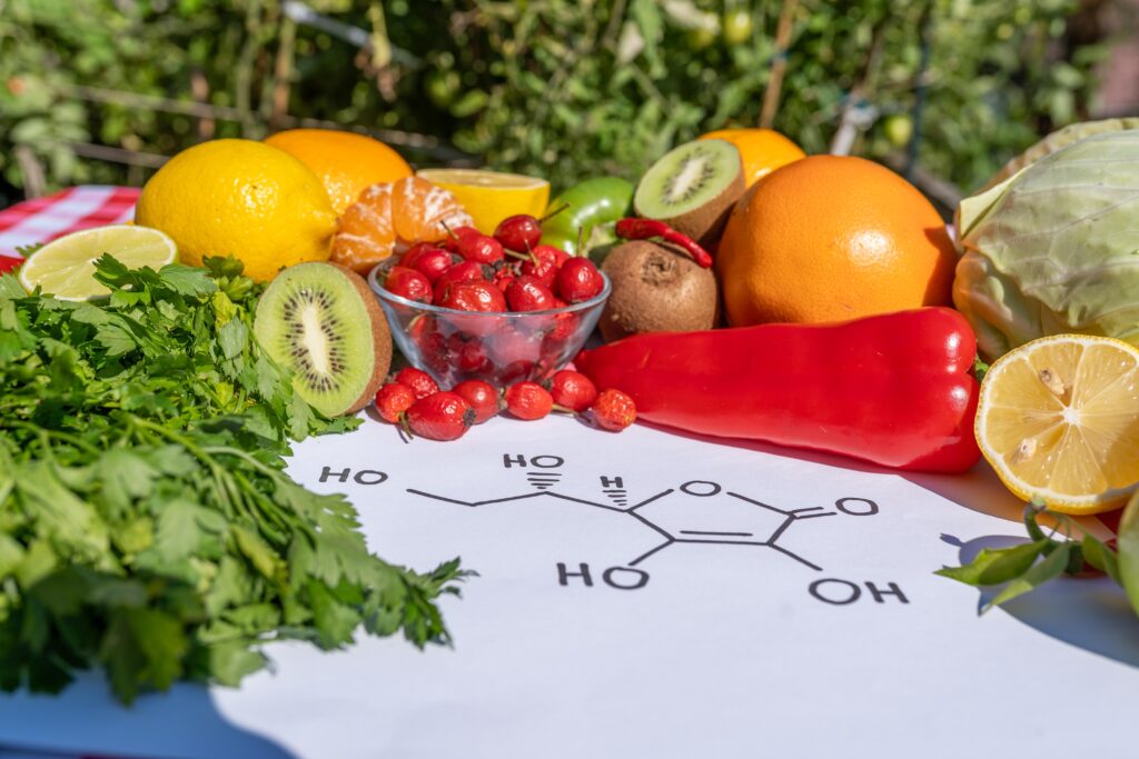 Vitamin C Supplement concept with oranges and natural vitamin rich foods
