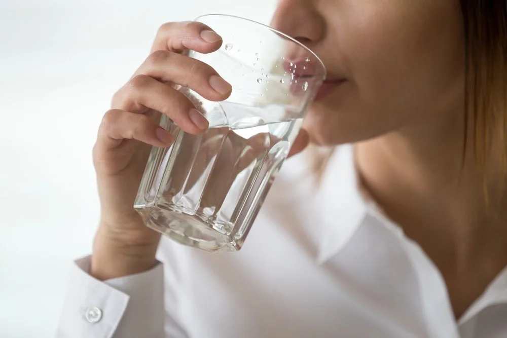Glass of drinking Water on a table promoting hydration and healthy living